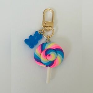 Neon Rainbow Swirl Lollipop Keychain with Blue Gummy Bear Charm
